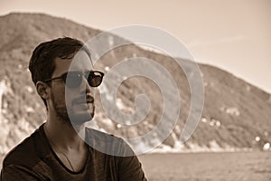 Young model men wearing sunglasses on the beach