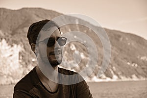 Young model men wearing sunglasses on the beach