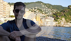 Young model men wearing sunglasses on the beach