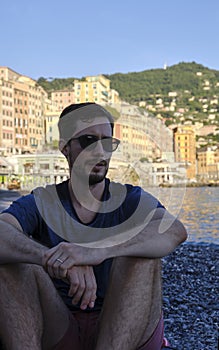 Young model men wearing sunglasses on the beach