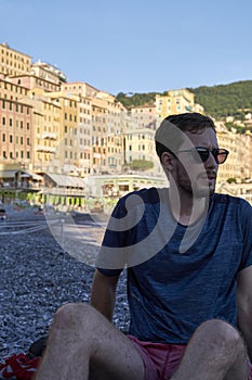 Young model men wearing sunglasses on the beach