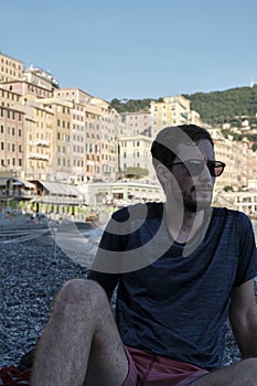 Young model men wearing sunglasses on the beach