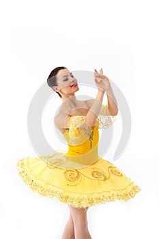 Young modern ballet dancer in yellow dress isolated on white background