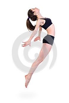 Young modern ballet dancer jumping on white