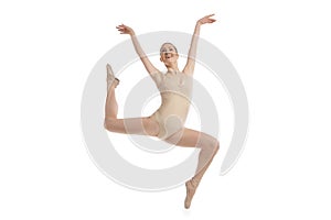 Young modern ballet dancer jumping on white