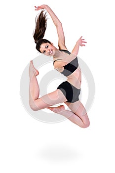 Young modern ballet dancer jumping on white
