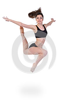 Young modern ballet dancer jumping on white background