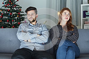 Young modern couple is irritated of christmas