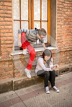 Young modern couple sharing mobile information