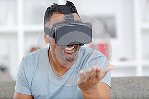 young modern man using 3d goggle