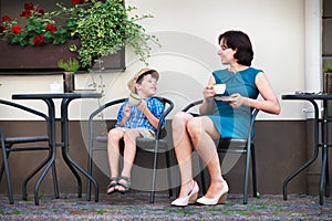 Young mom having coffee with her son