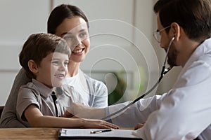 Young mom and little son at consultation in hospital photo