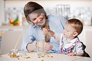 Young mom playing with baby