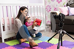 Young mom recording parenting blog