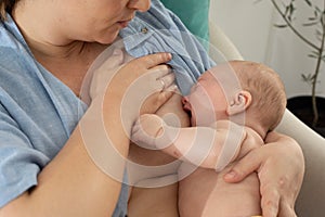 The young mom wants to breastfeed her newborn baby