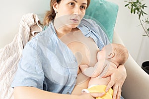 The young mom wants to breastfeed her newborn baby