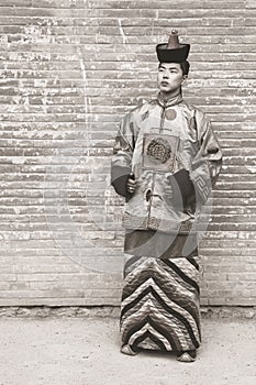 Young man in an old Mongolian costume.