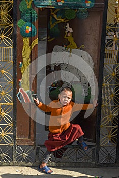 Young monk at the buddhist monastery of Bodhnath on Nepal