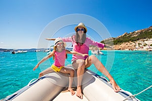 Young mother with adorable daughter enjoy vacation