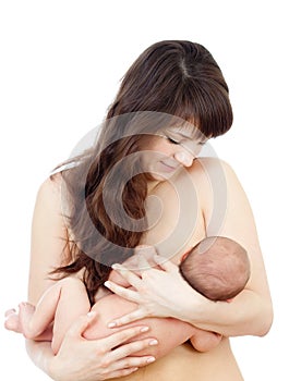 Young mother breast feeding her small newborn baby