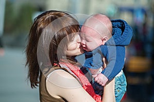 Young mother calming her crying baby