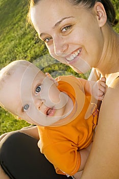 Young mother with a child laughs