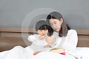 Young mother and child show motherly love and affection