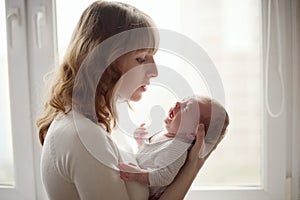 Young mother with crying baby