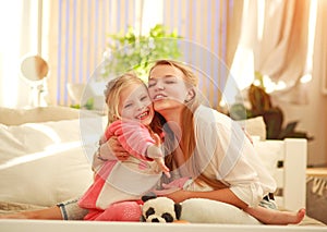 Young mother and daughter are having fun playing at home, happy parenting and family leisure