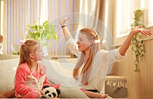 Young mother and daughter are having fun playing at home, happy parenting and family leisure