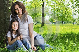 Young mother and daughter in park