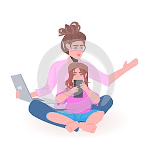 Young mother with daughter using digital devices happy family spending time together motherhood concept