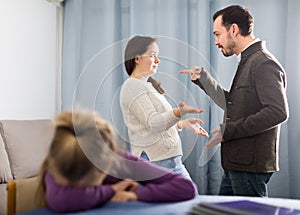 Young mother and father arguing with each other