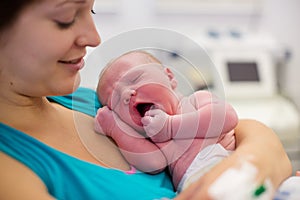 Young mother giving birth to a baby