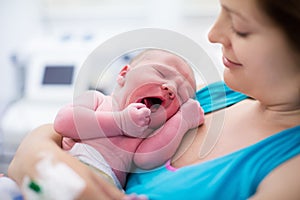 Young mother giving birth to a baby