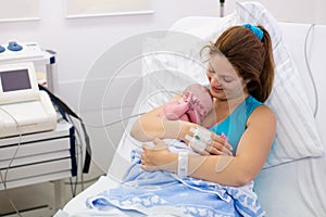 Young mother giving birth to a baby