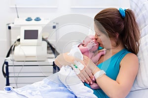 Young mother giving birth to a baby