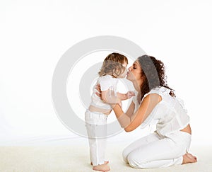 Young mother having fun with her little son