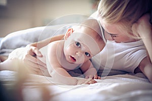 Young mother with her baby boy. Portrait.