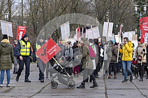 Young mother with her child in baby buggy at the march for Animal Advocacy in Riga, Latvia, Europe
