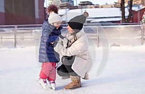 Young mother and her cute little daughter on a