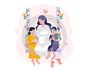 Young Mother with her daughter and son sitting on a swing decorated with flowers. Mother and her children embrace sitting on a