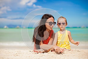 Young mother and her little daughter enjoying