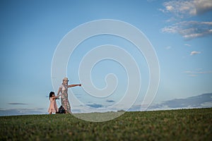 Young mother and her little daughter walking