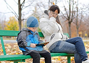 Young mother with her son in the park