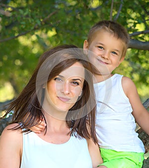 Young mother and her son spending time outdoor