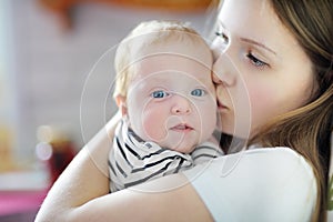 Young mother with her sweet newborn