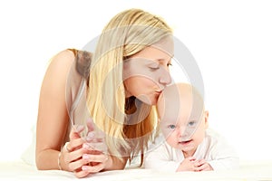 Young mother kissing baby