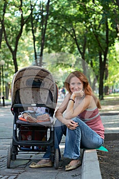 Young mother with perambulator