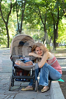 Young mother with perambulator